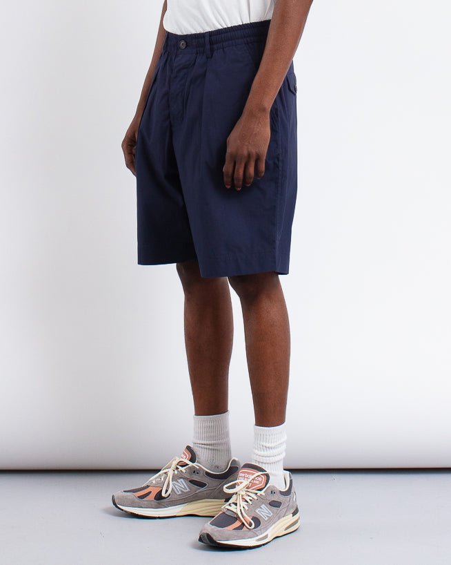 Pleated Track Short Peached Poplin Navy - UNIVERSAL WORKS