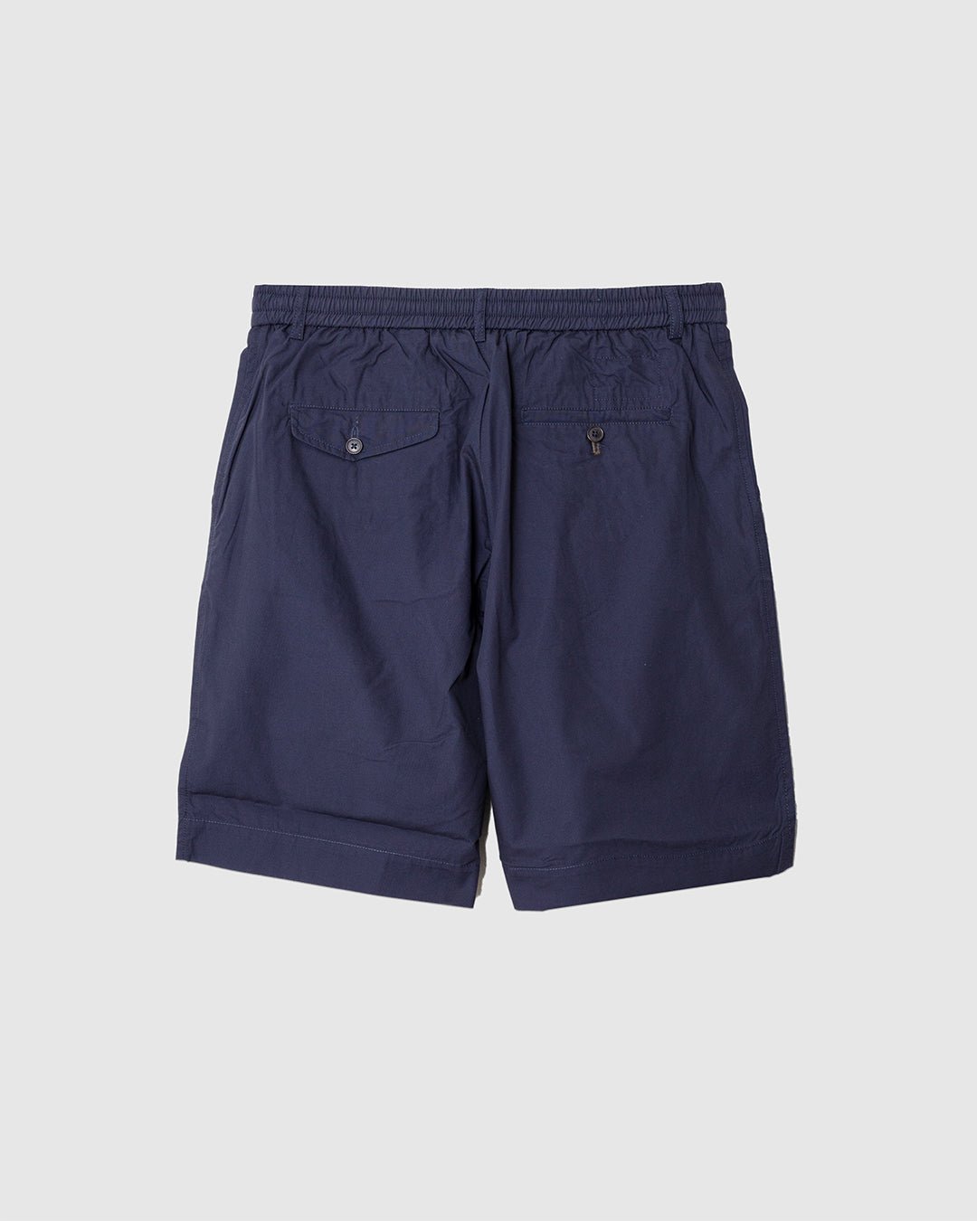 Pleated Track Short Peached Poplin Navy - UNIVERSAL WORKS