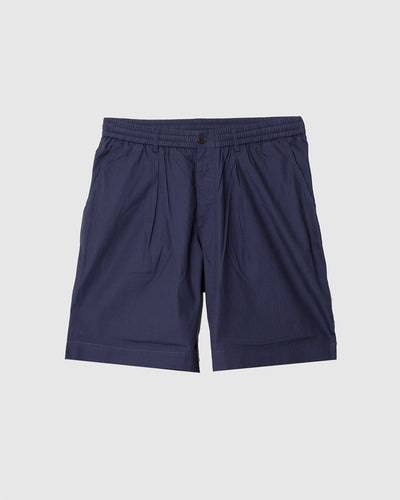Pleated Track Short Peached Poplin Navy - UNIVERSAL WORKS
